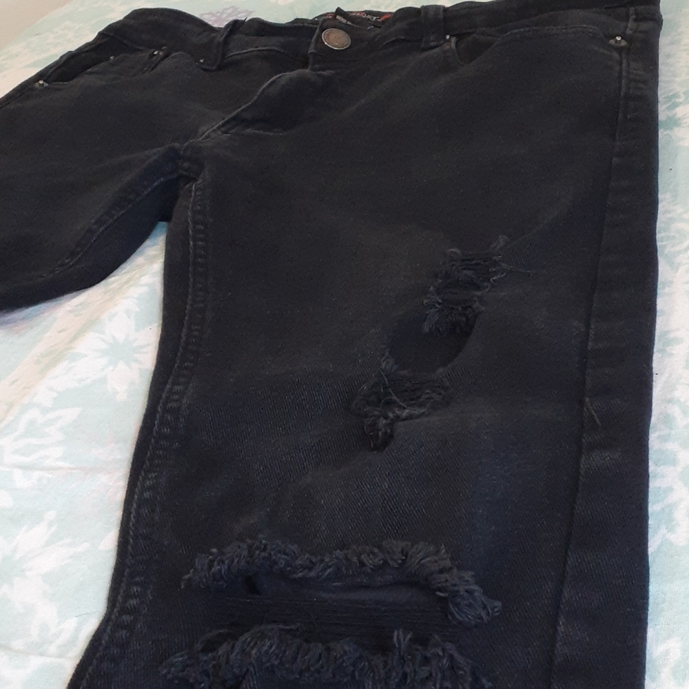 Copper rivet ripped jeans